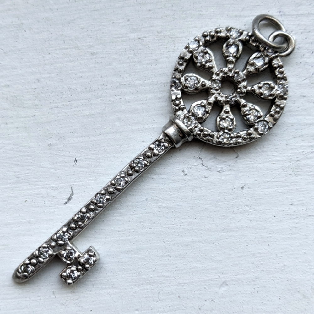 Vintage Tiffany & co diamond and silver petals key pendant